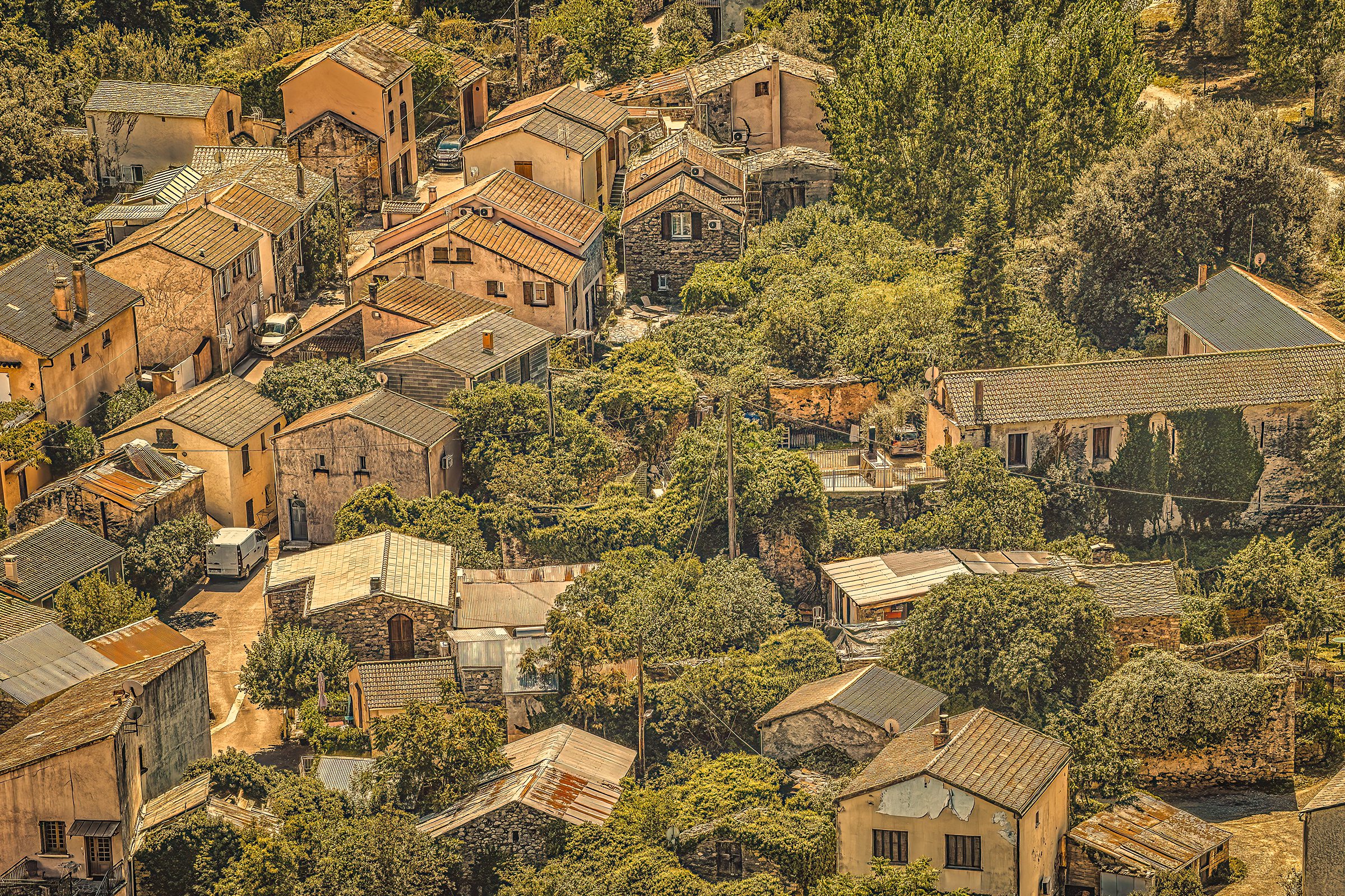 Corte Corsica village - Traditional stone houses with terracotta roofs in golden light